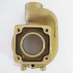 A brass casting with a hole in the middle.