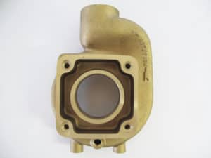 A brass casting with a hole in the middle.