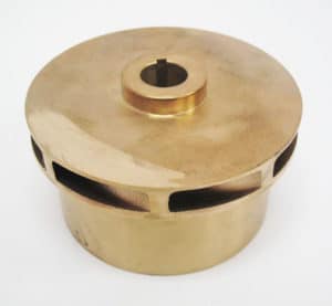 A brass pot with a hole in it.