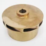 A brass pot with a hole in it.